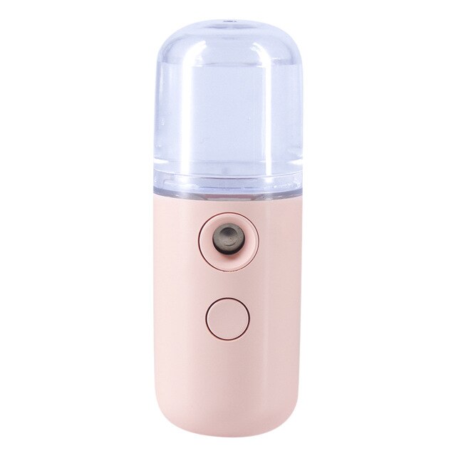 A travel-friendly, light pink Piw Wee 30ml Mini Face Spray with a clear top and two buttons on the front, providing deep moisture on the go.