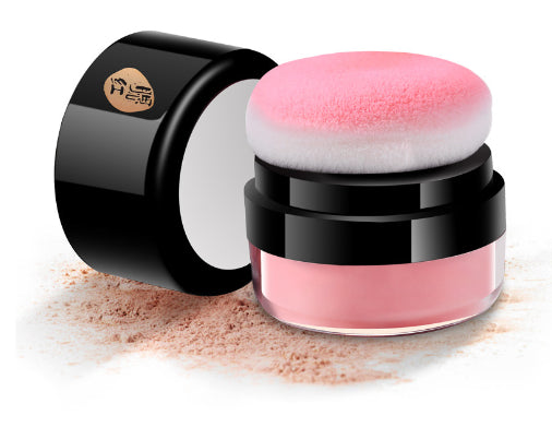 A small, black jar with a screw cap from Piw Wee contains Face Blusher Powder in pink and features a built-in sponge applicator.